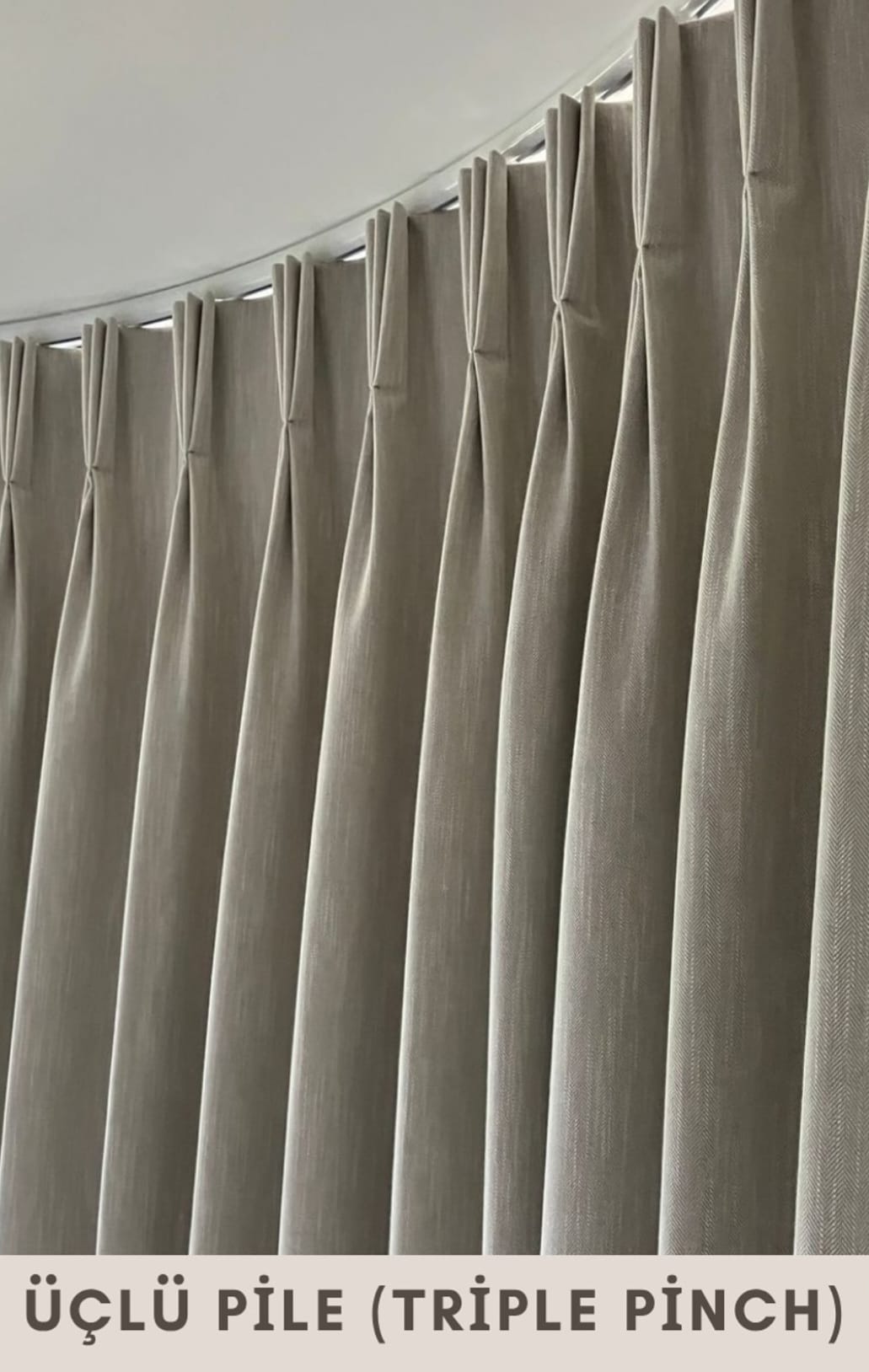 Pencil pleat drapery in a bright living room