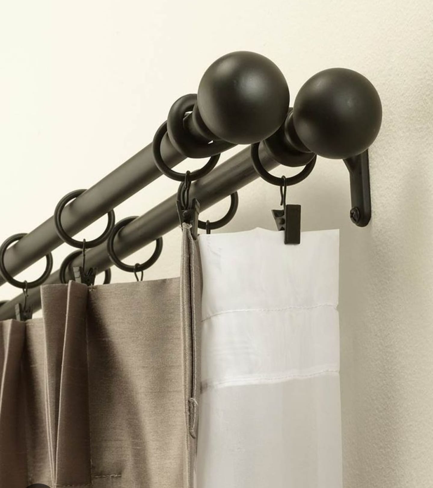 Drapery rod mounted above window