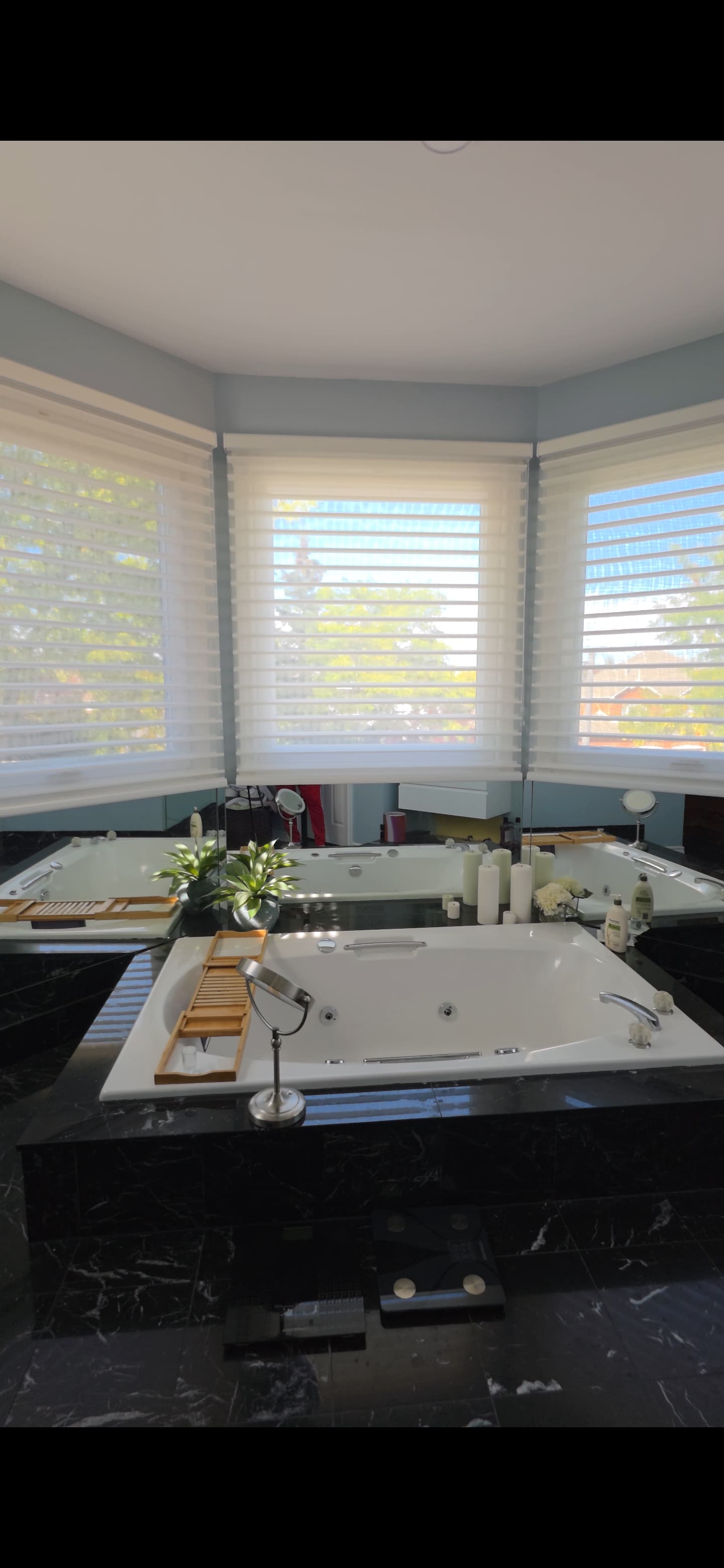 Silhouette sheer shades installed on large windows in a living room