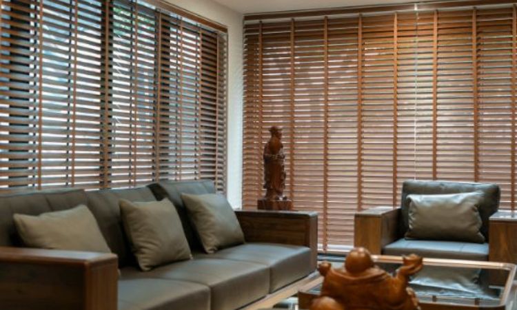 Wood blinds installed on a large living room window