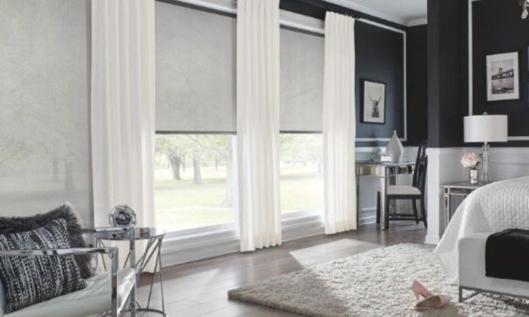Roller shades installed on large modern windows